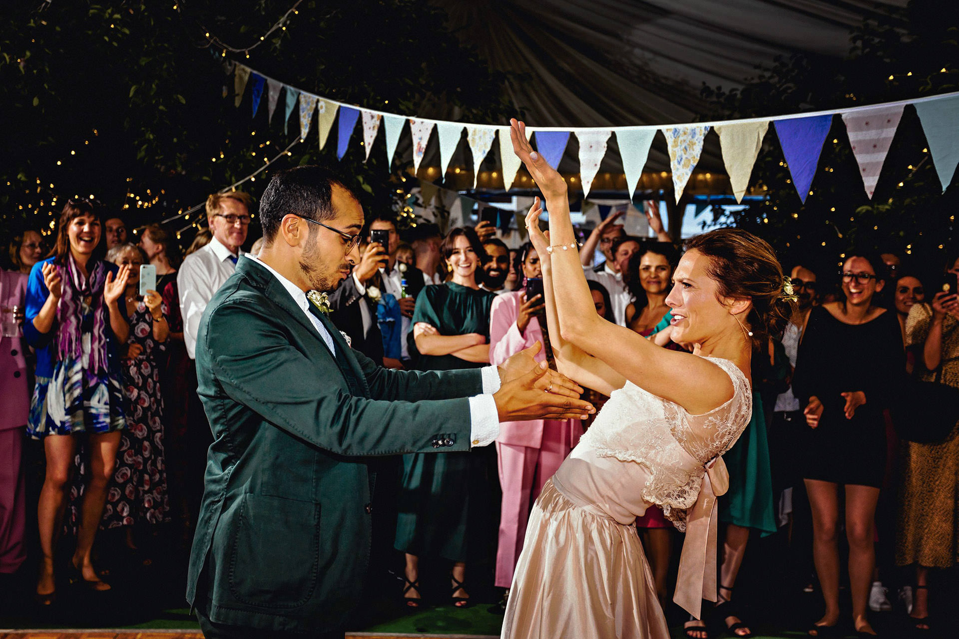 crazy first dance in marquee next to bunting