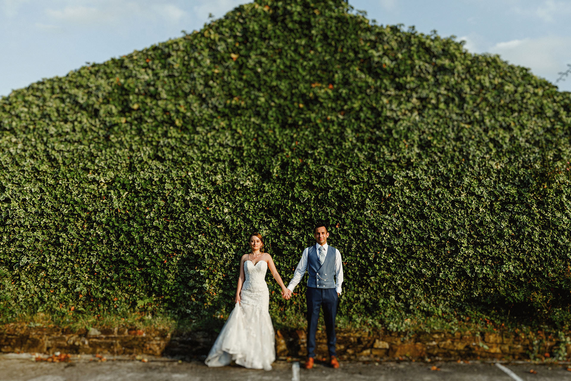 ivy covered building, wedding photo of bride and groom, tilt and shift lens