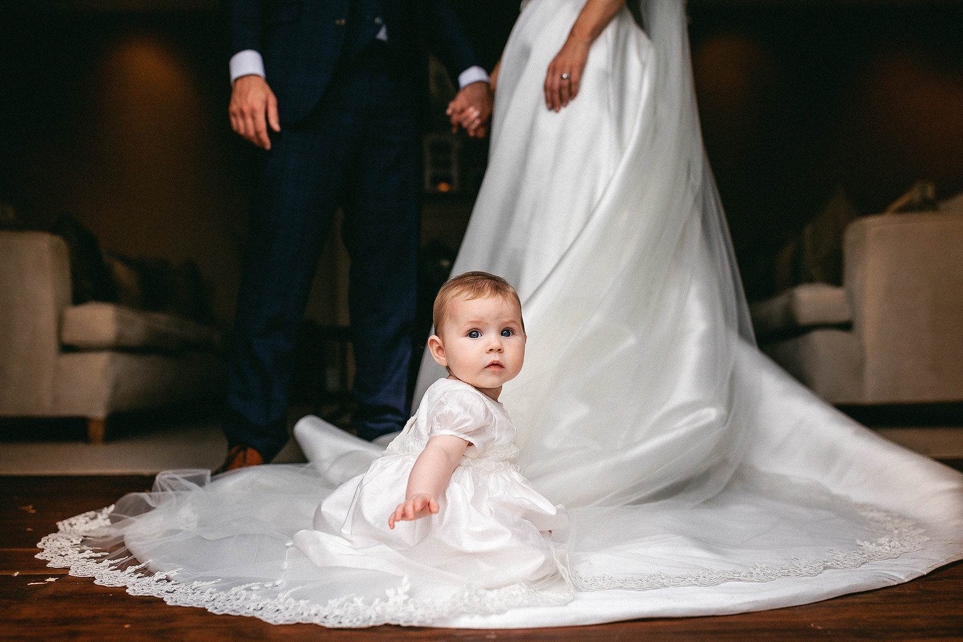 baby on wedding dress