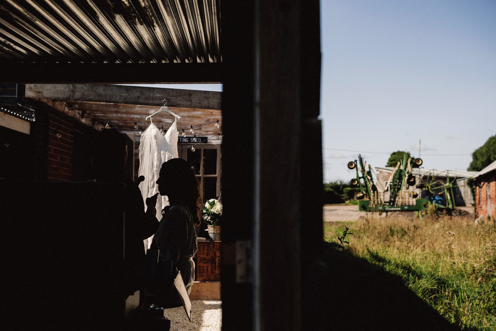 wedding dress hanging up on the farm 