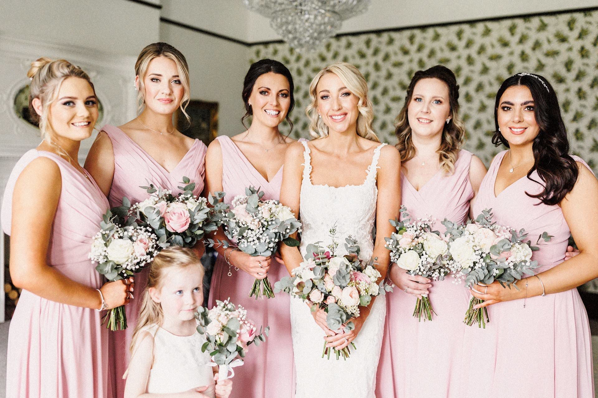 bride and bridesmaids in white and pink