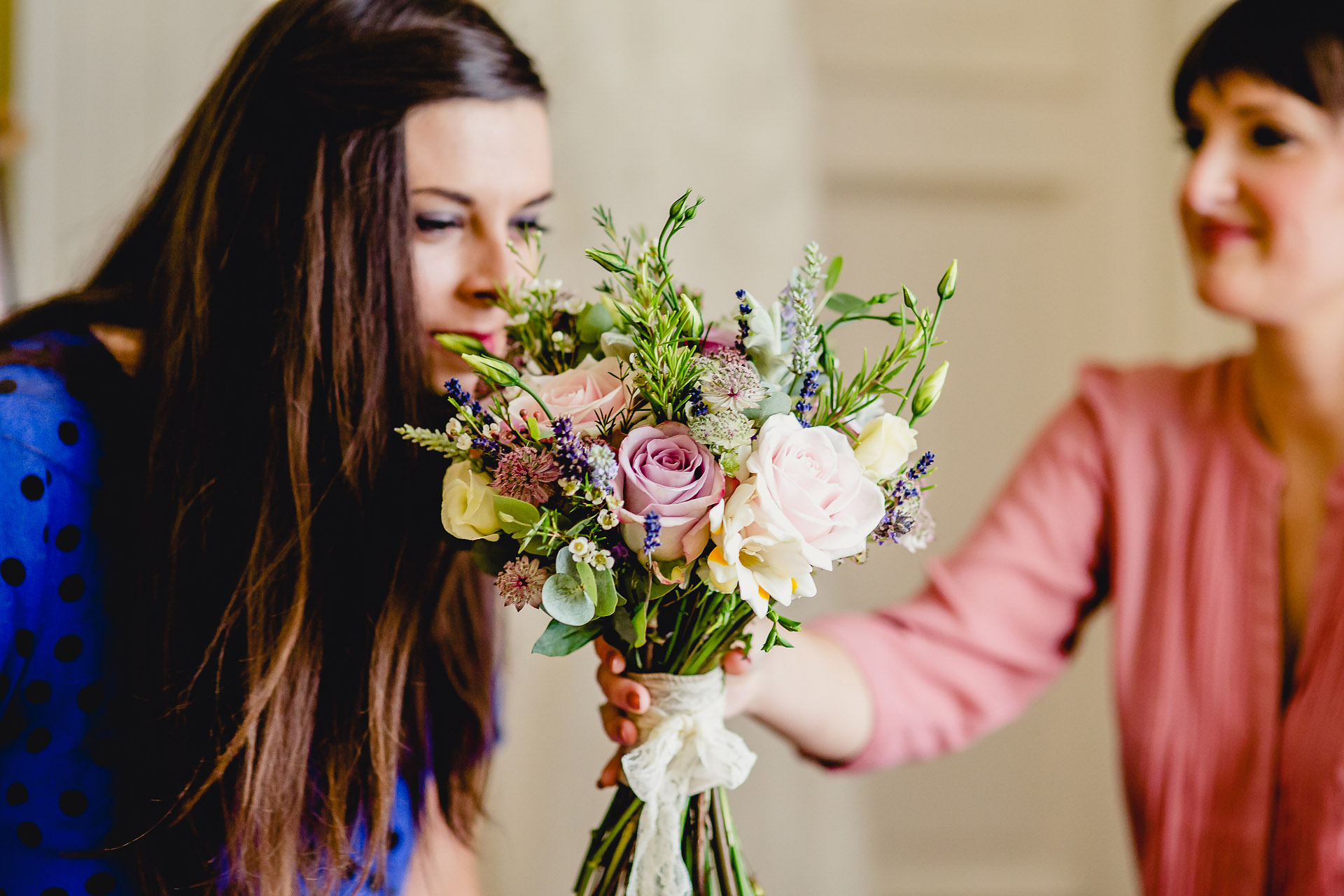 photographs of the bridesmaid smelling the boquet 