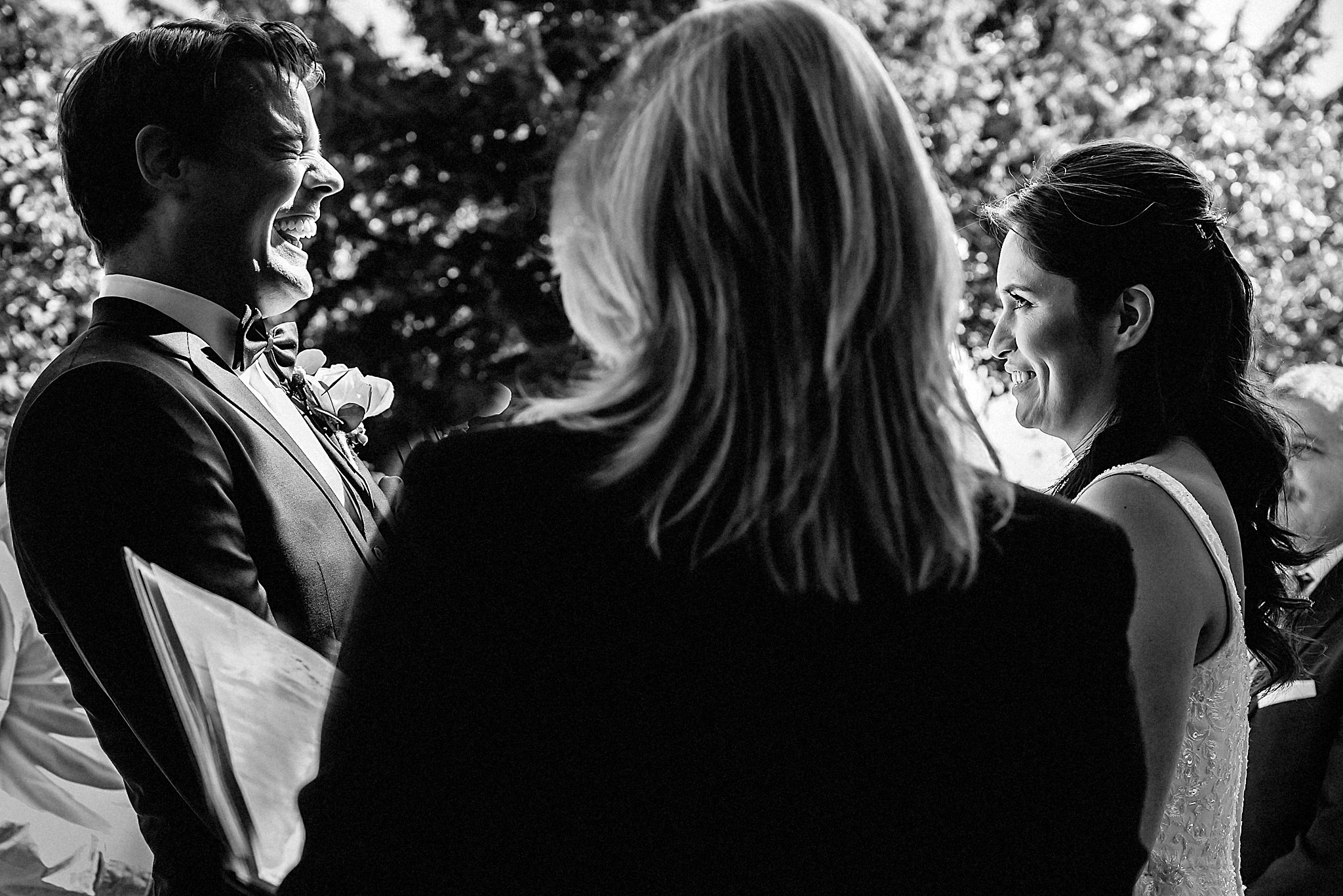 groom laughing during the nuptials 