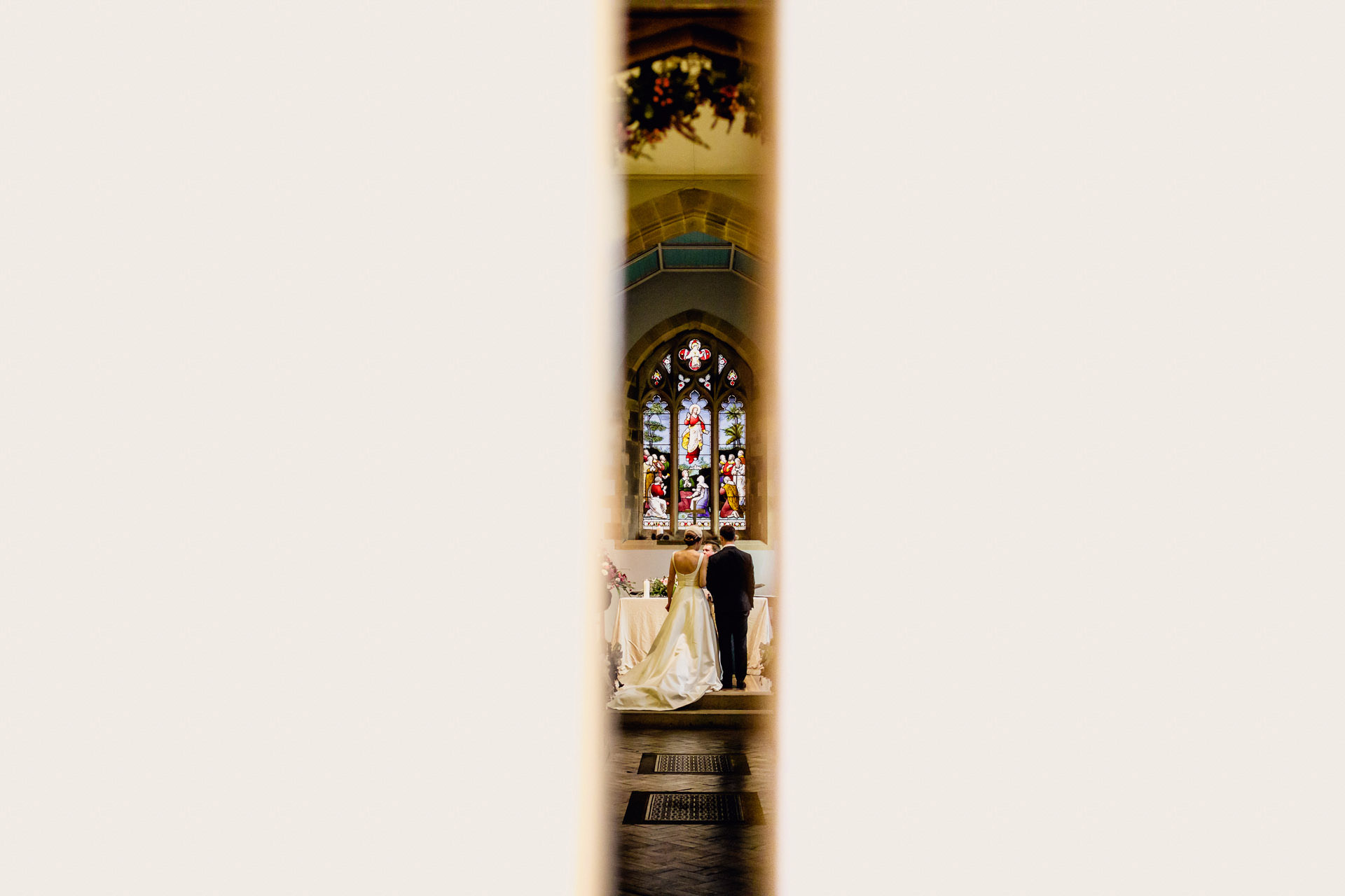 photo through the door of the church down the aisle