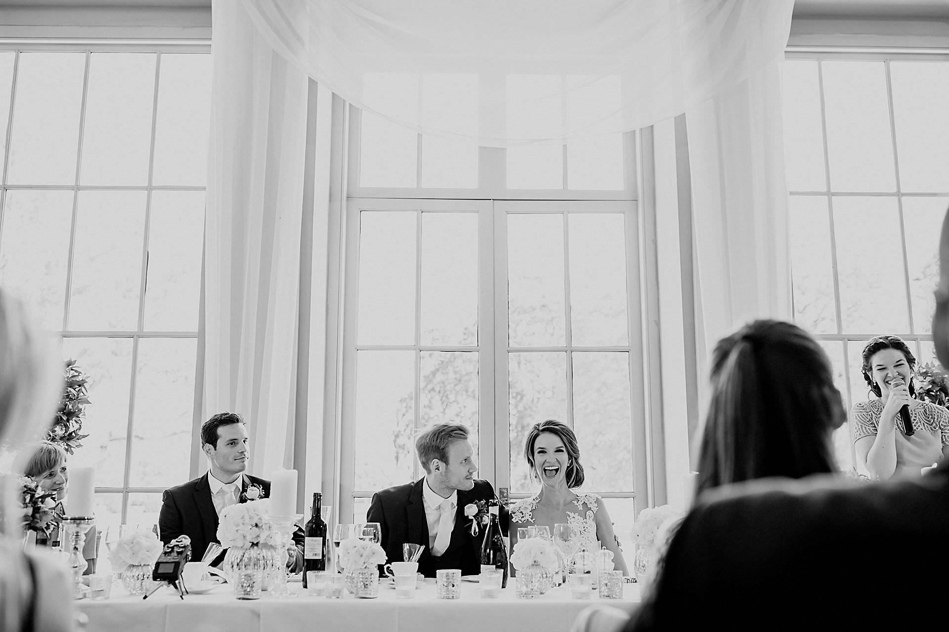 bride and groom, best man, maid of honour at the top table 