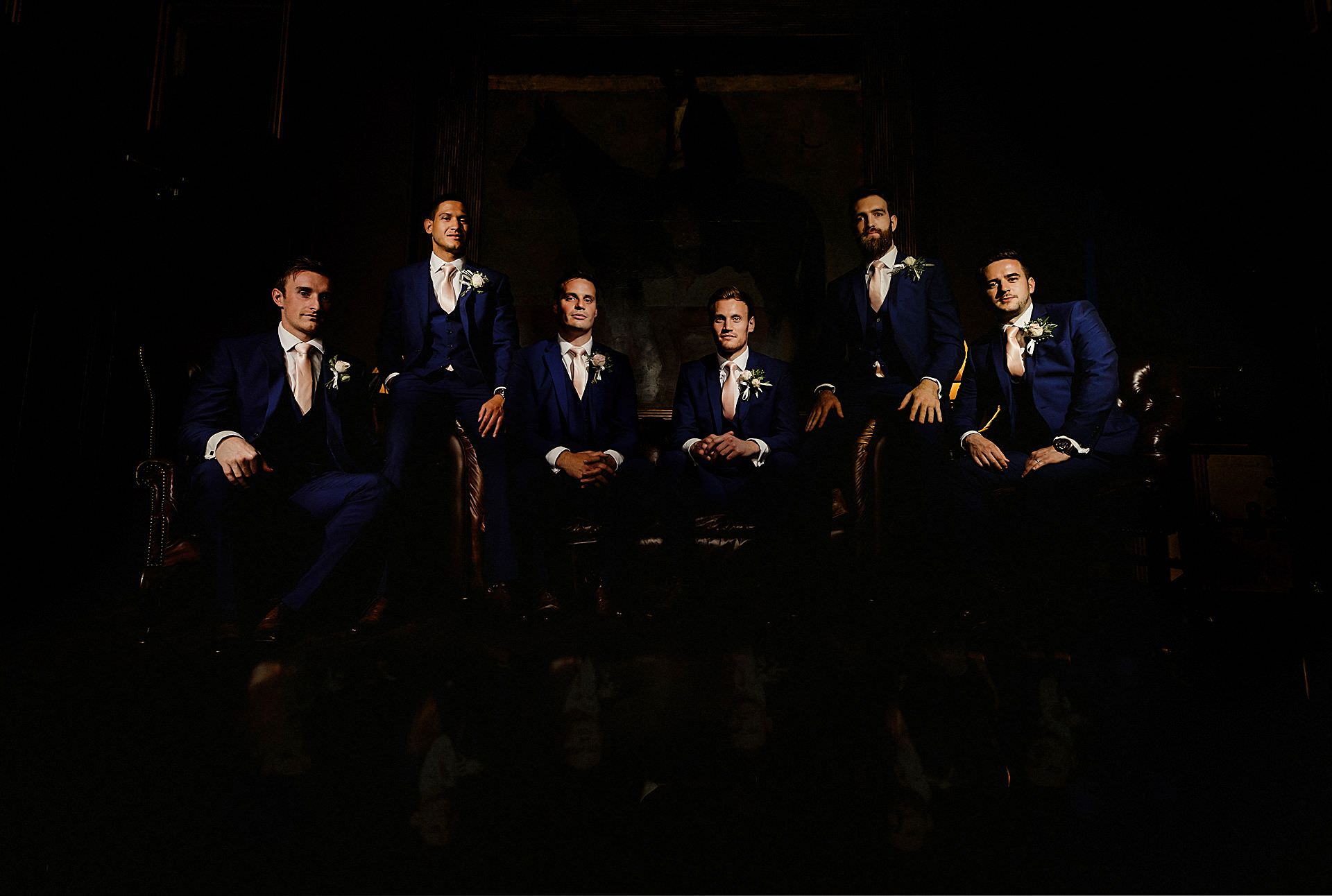 all of the groomsmen on the chairs at stubton hall, newark, lincolnshire