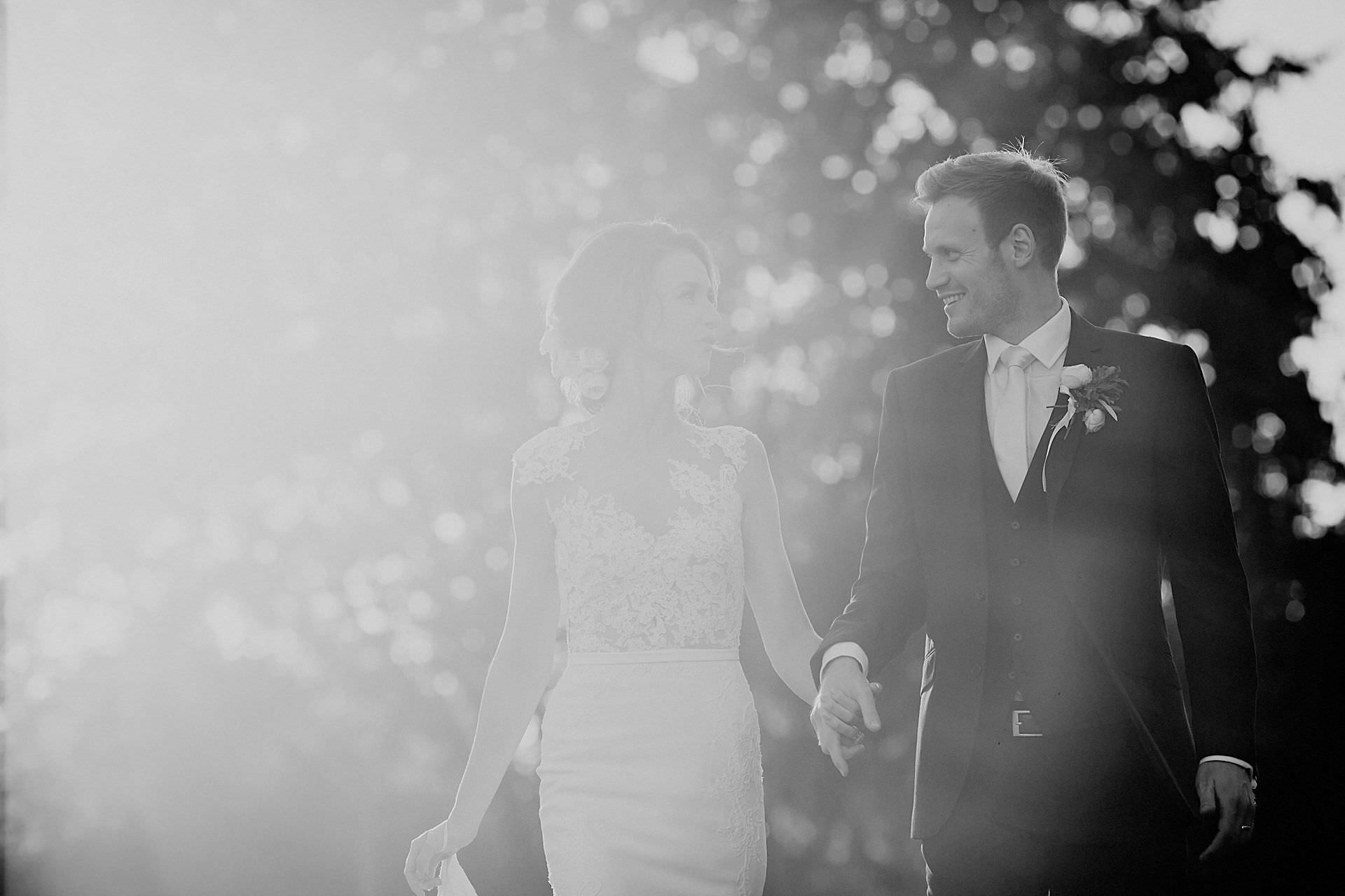 lens flare with bride and groom 