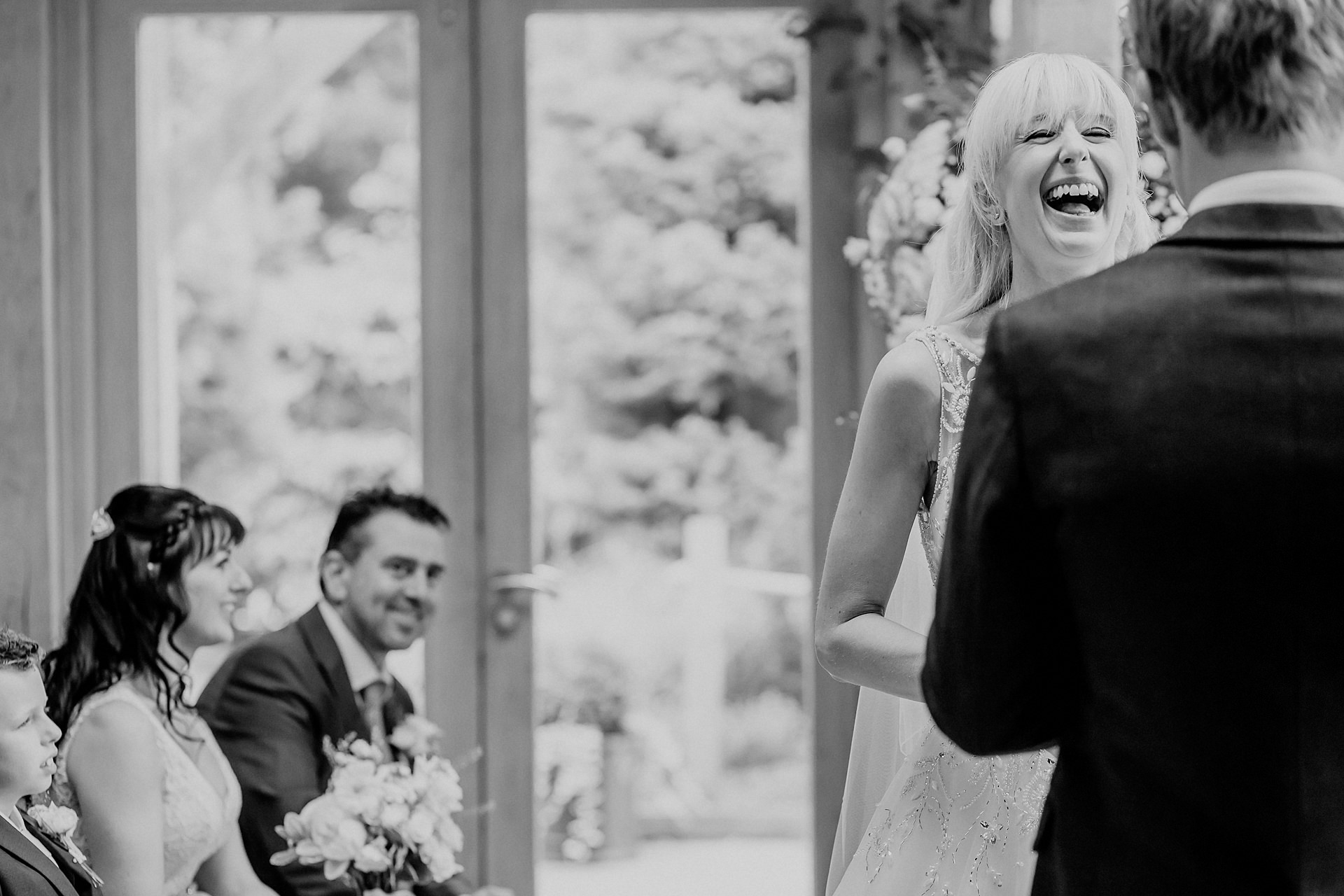 laughing bride during ceremony