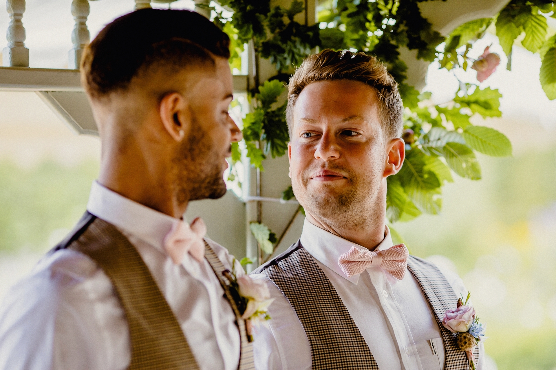 two grooms looking happy 
