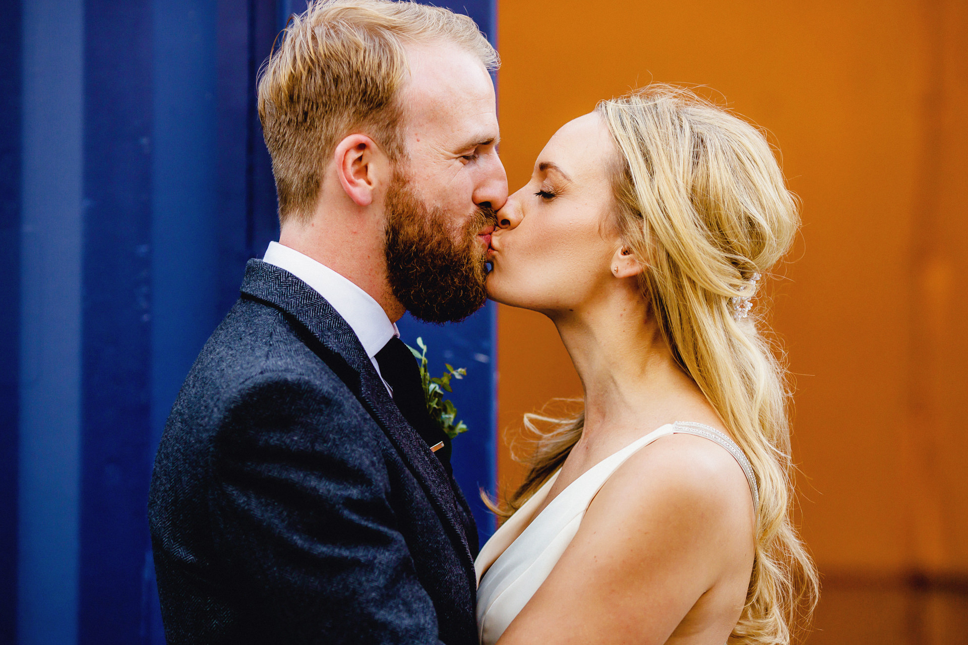 kissing, bride and groom portrait