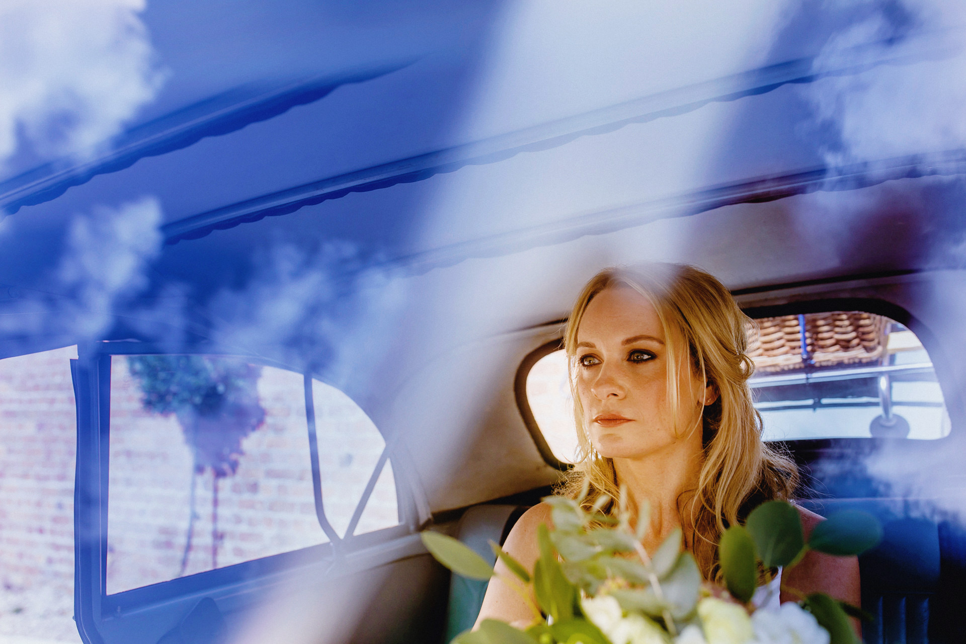 bride in the car, through windscreen