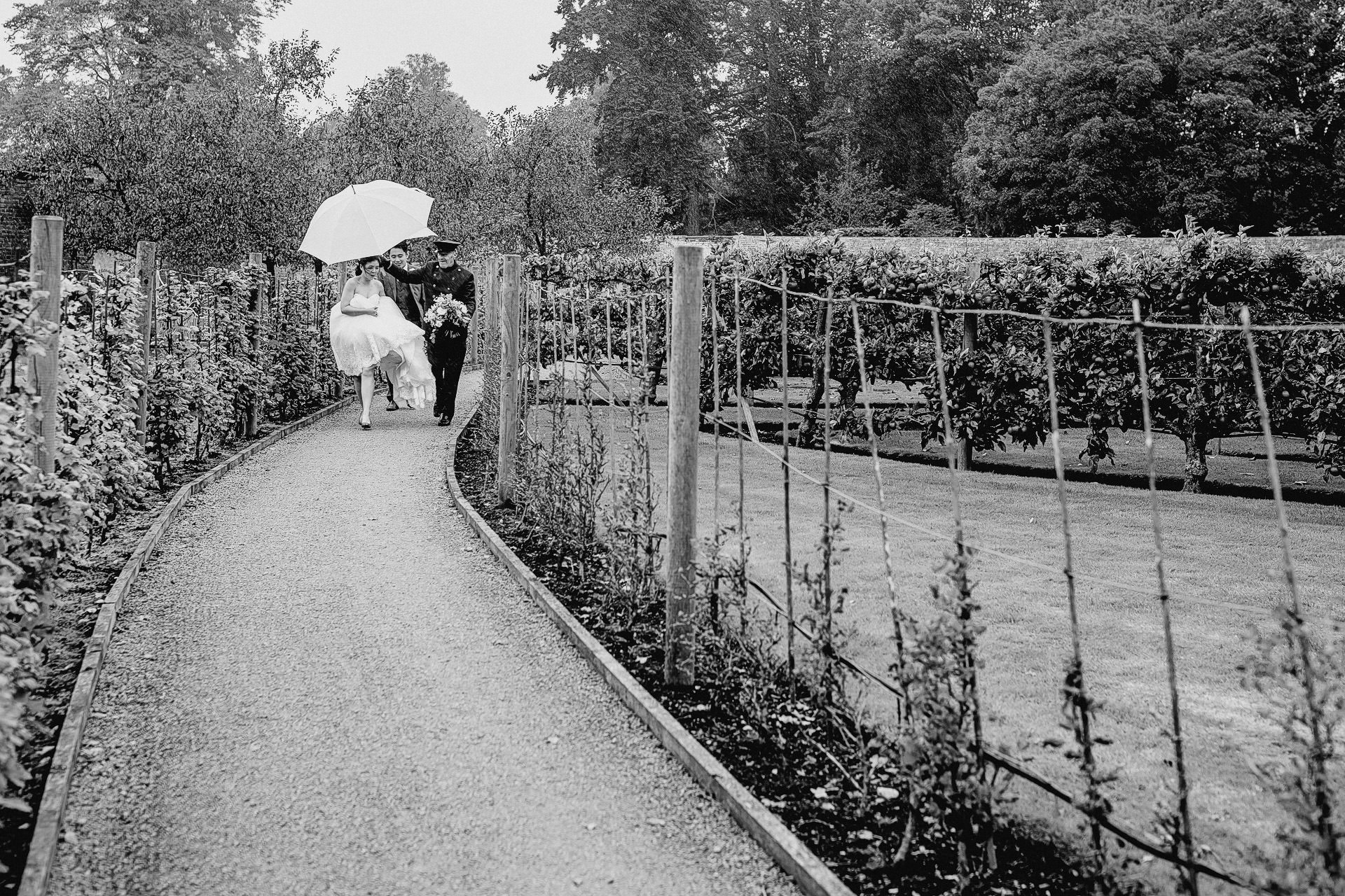 combermere abbey wedding photography. rain, umbrellas