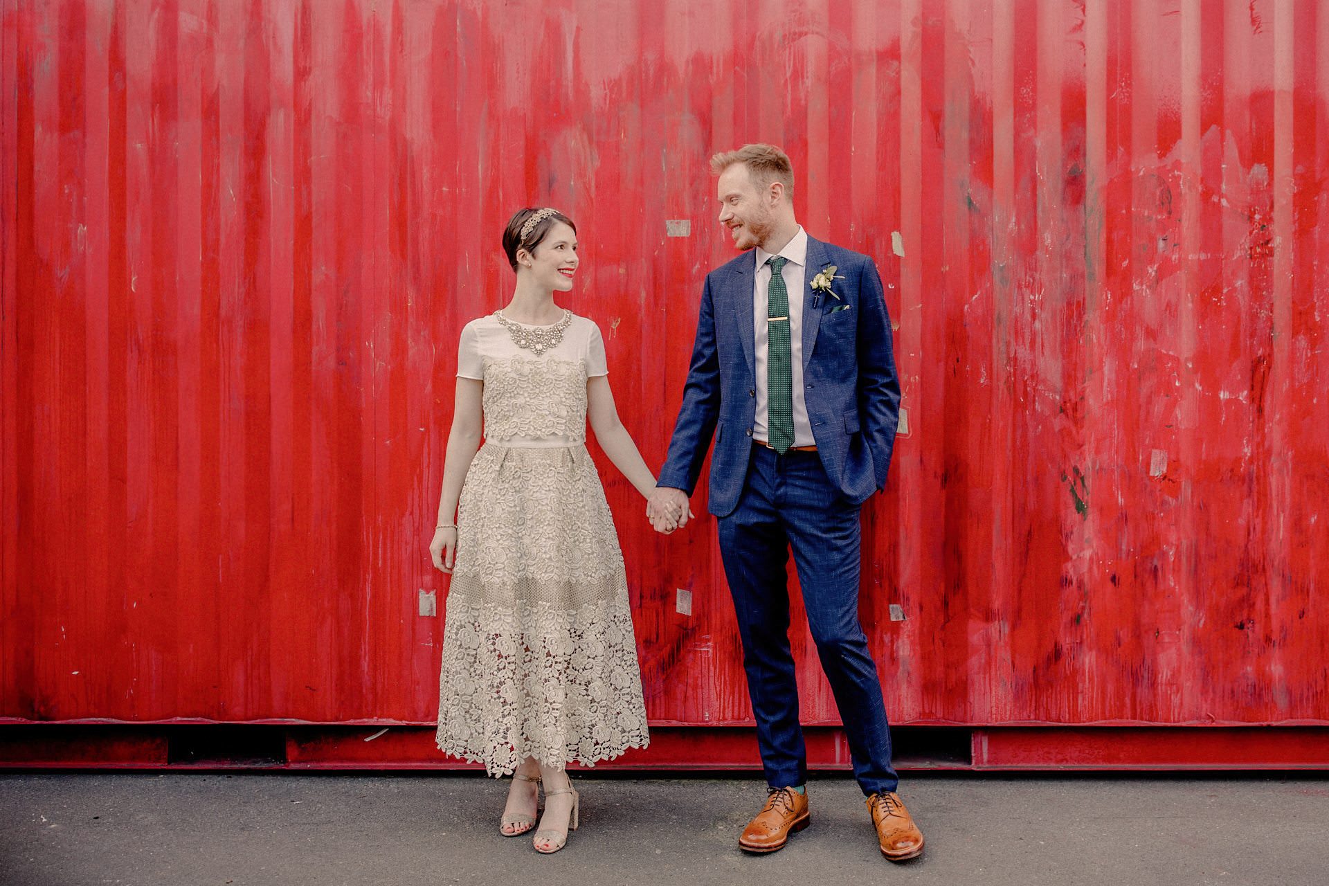 portrait of bride and groom, red container, wedding in london
