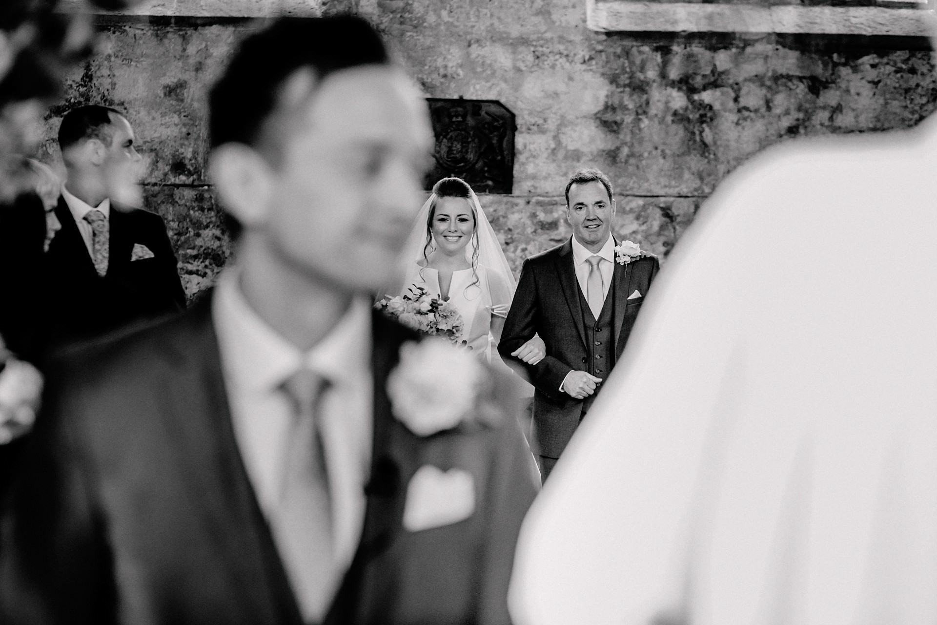 walkinbg down the aisle at blanchlands abbey, derwent water