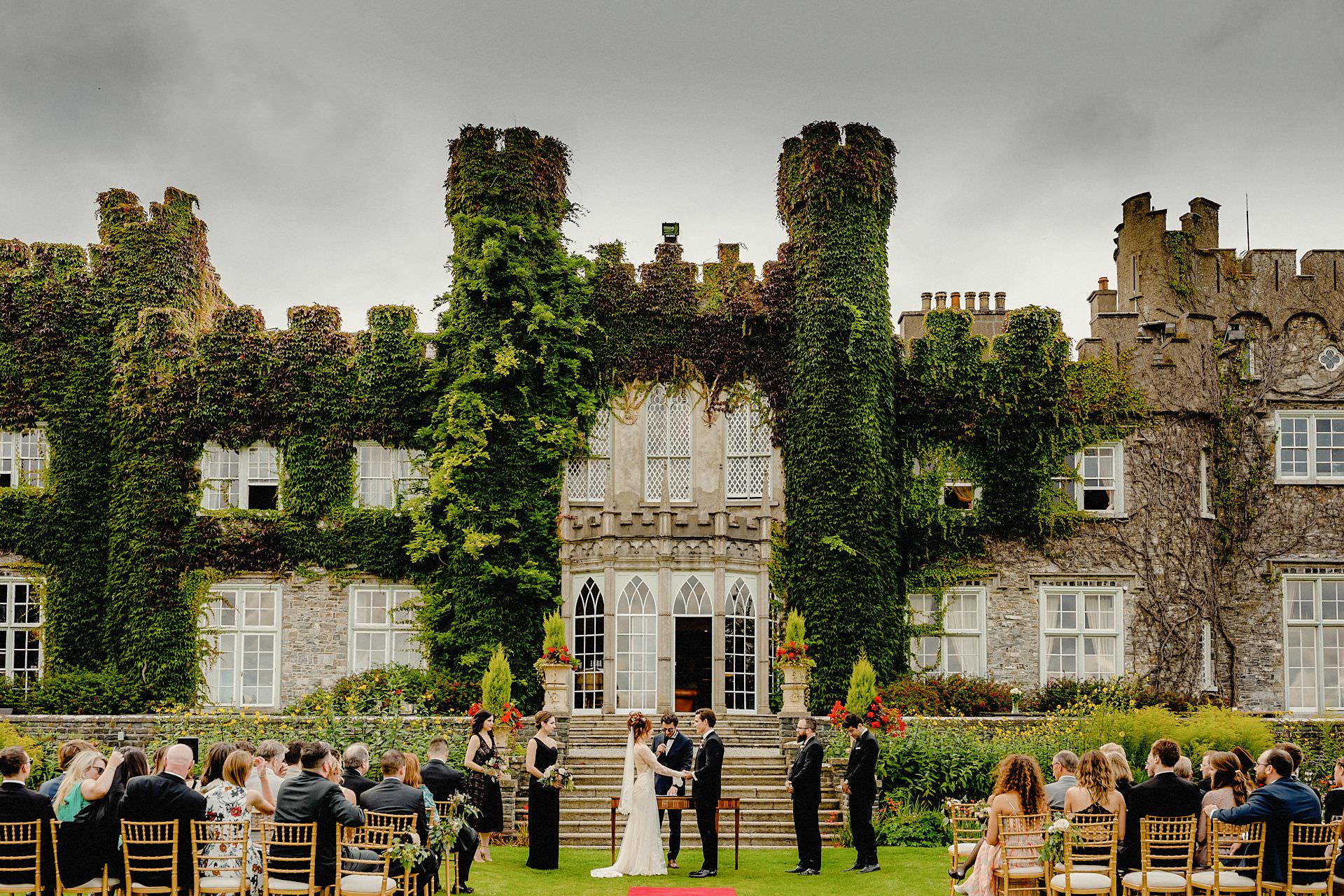 wedding ceremony outside the castle at luttrellstown