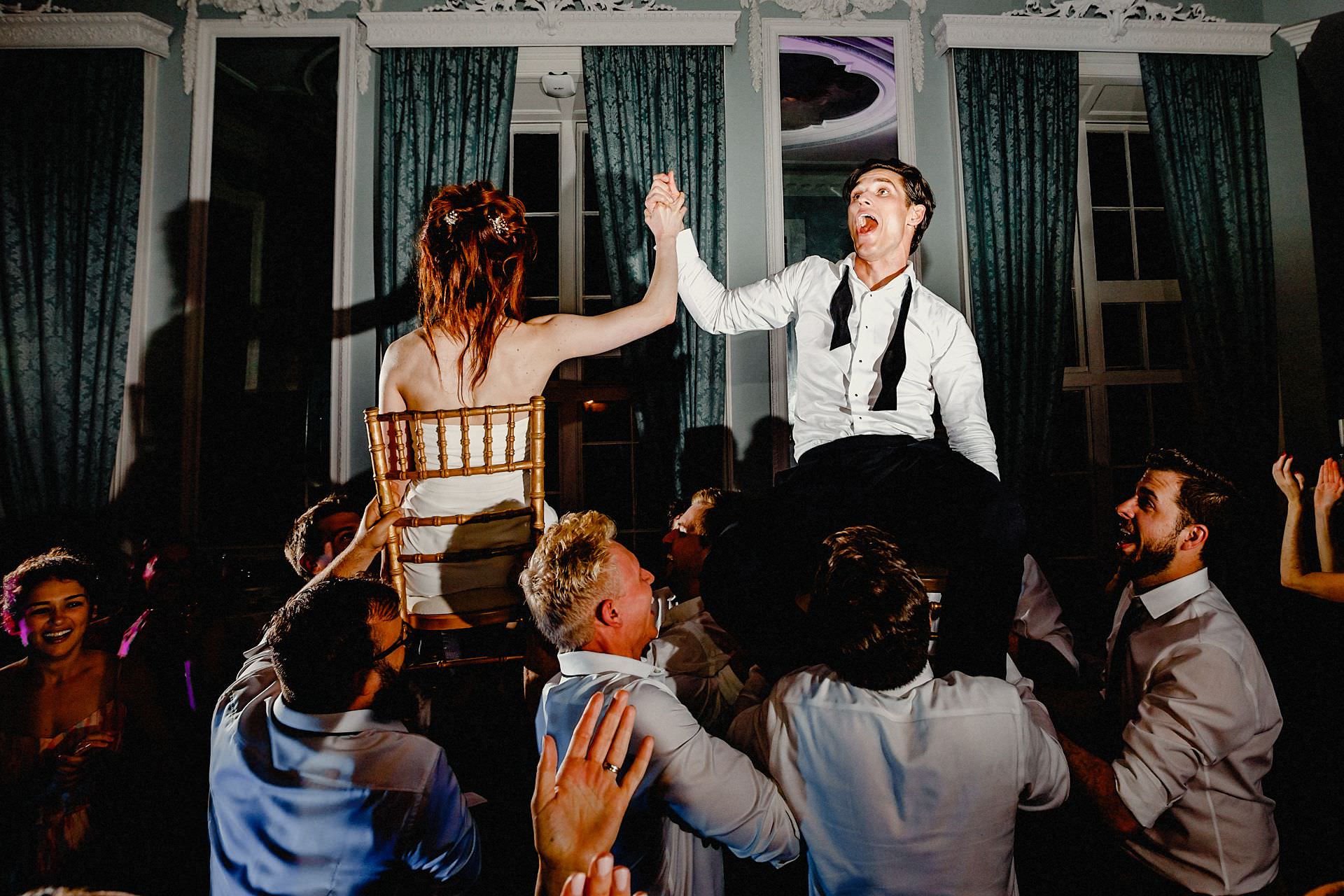 raise up the bride and groom on the dance floor