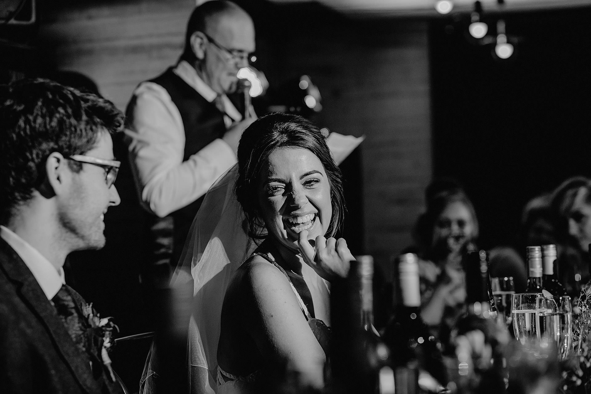 speeches, toasts during the wedding breakfast, bride laughing