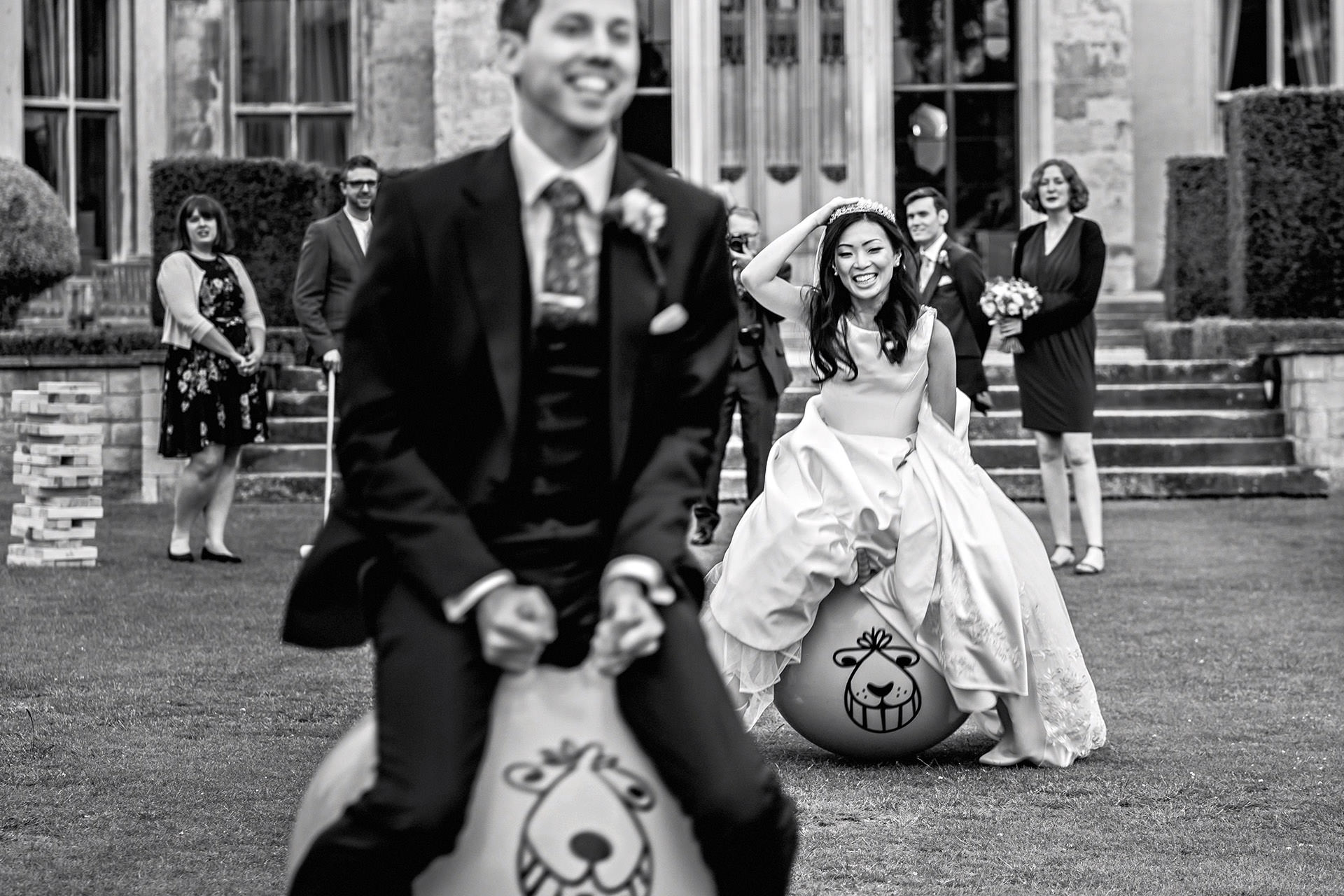 bride and groom on space hoppers