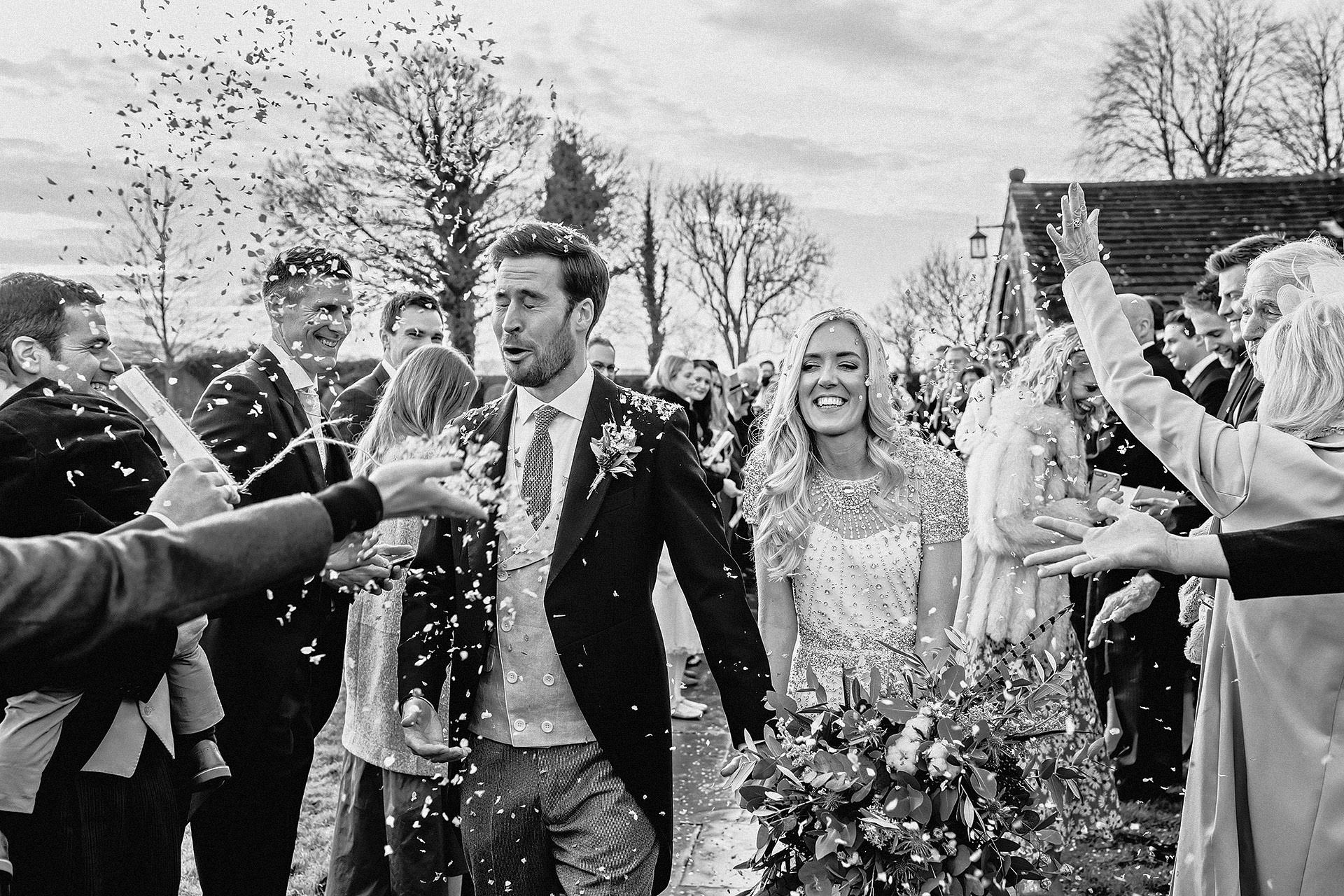 confetti throwing outside the church, documentary wedding photography 