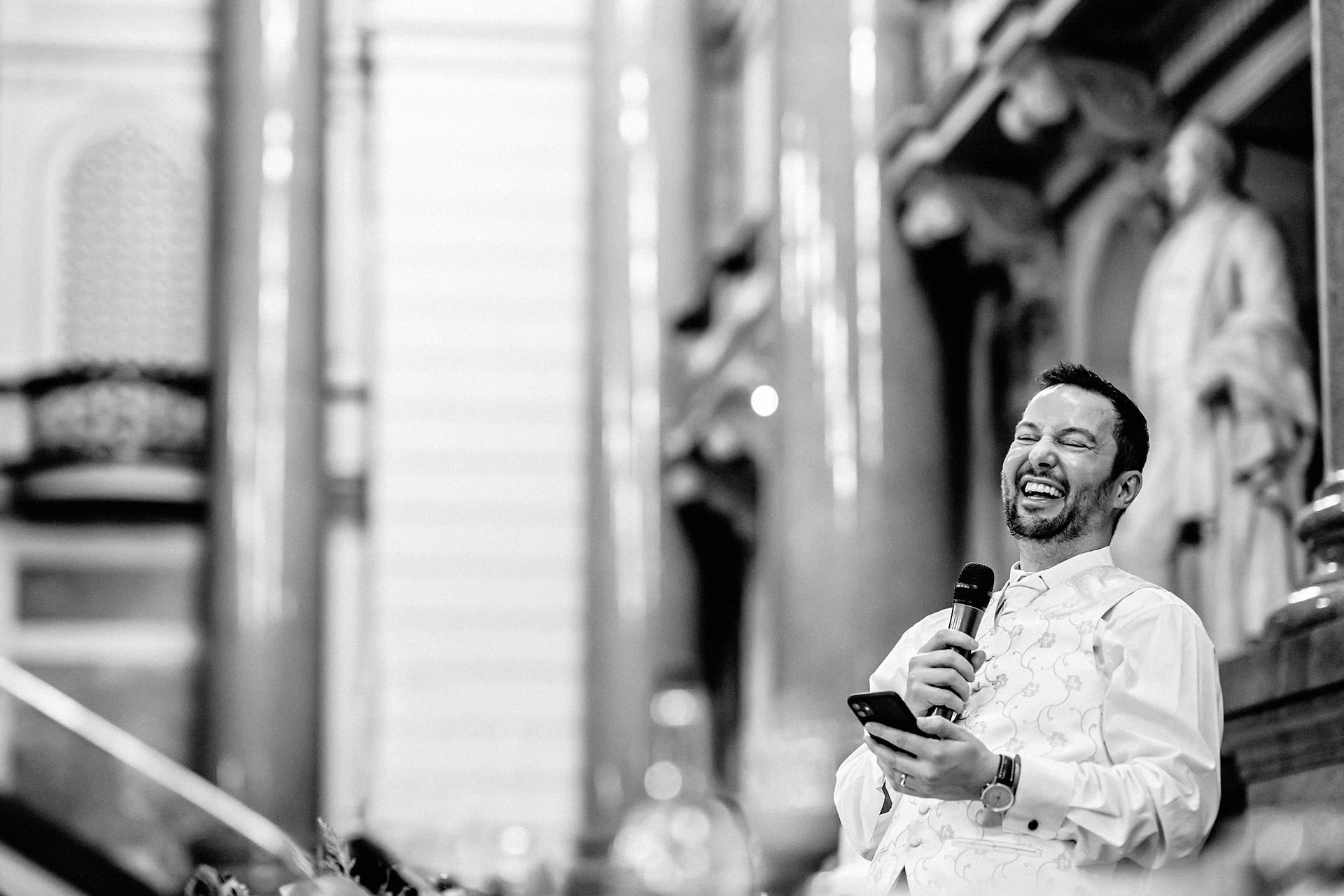 groom laughing during toasts