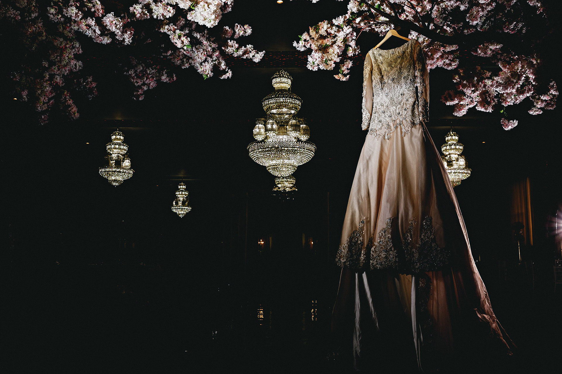 wedding dress hanging on blossom tree