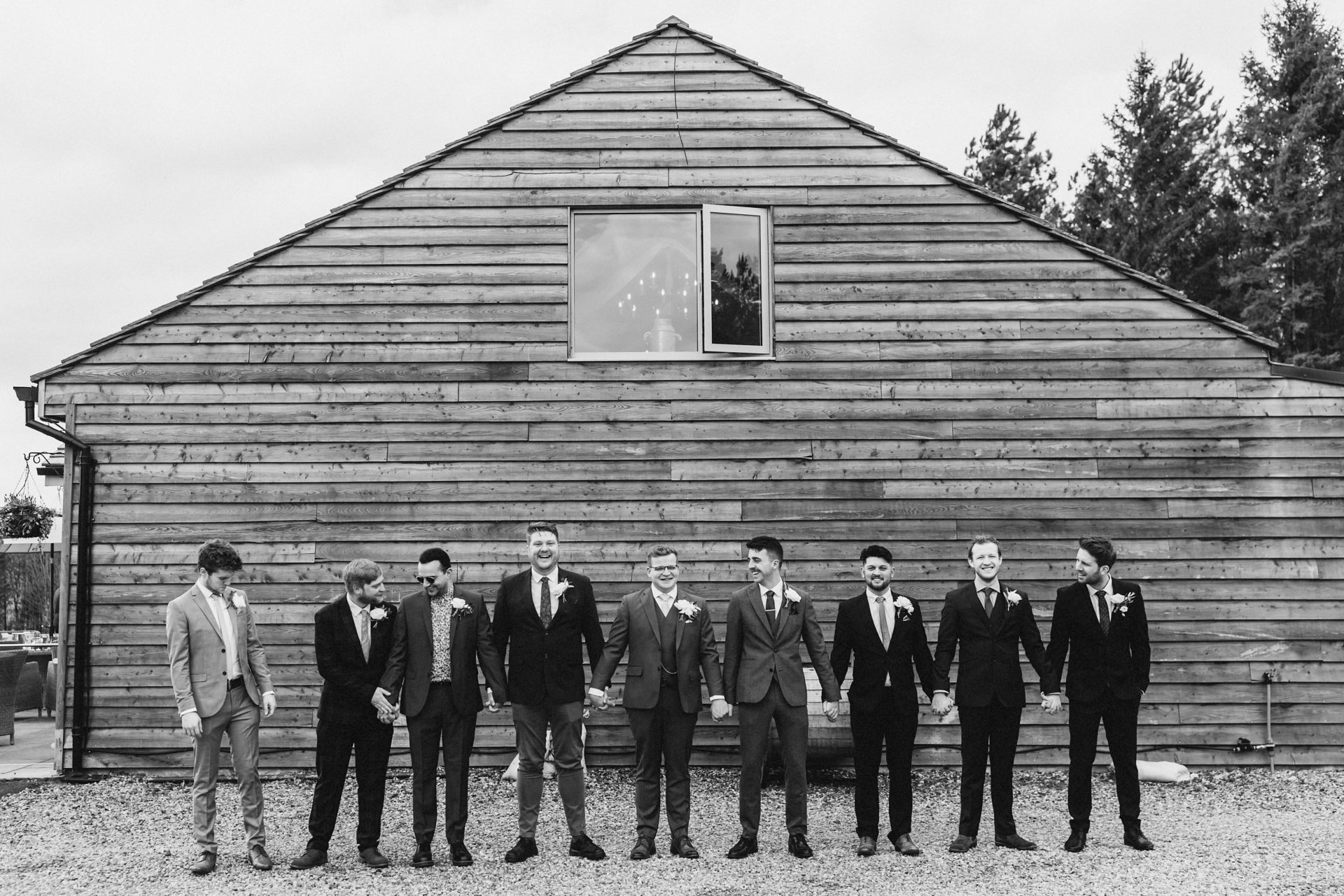 groomsmen outside the barn at hobbit hill